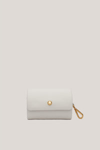 A white elegant coin purse made of quality and luxurious leather