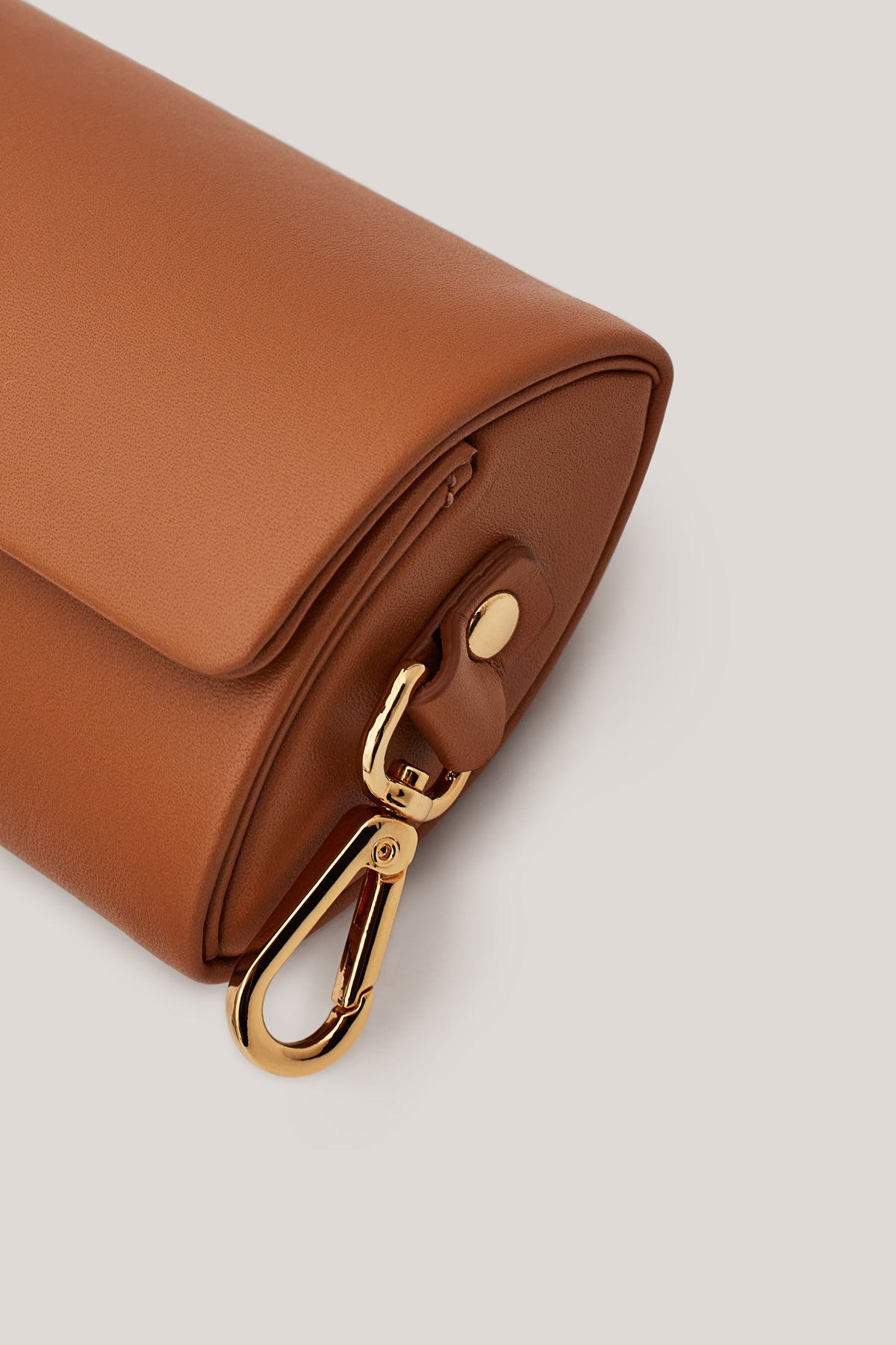 Didi carmelo is a hand crafted coin purse with a loop on its back side to fit perfectly onto most belts including the Lulu Belt Bag. 